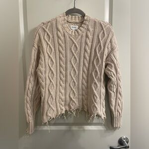 Pistola Beige distressed sweater.